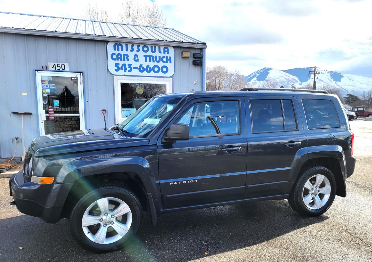 2014 Blue /Black Jeep Patriot Latittude (1C4NJRFB7ED) with an 2.4L I4 engine, 6 Speed Automatic transmission, located at 450 N Russell, Missoula, MT, 59801, (406) 543-6600, 46.874496, -114.017433 - Photo#0
